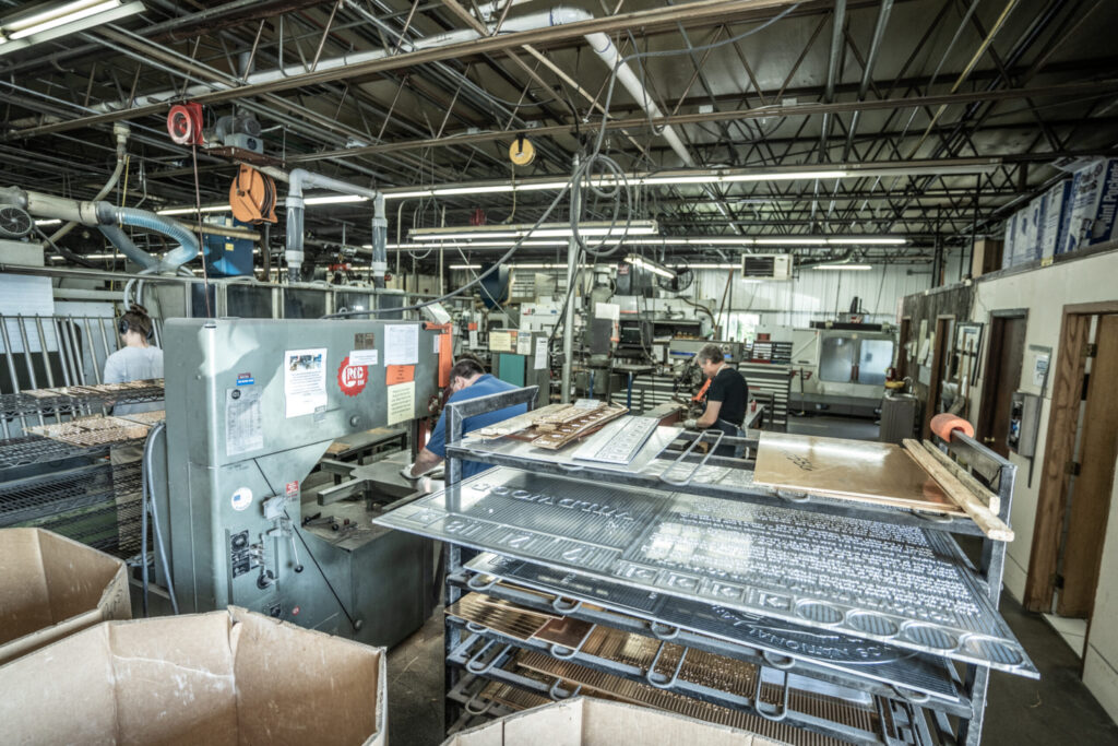 Image of inside a manufacturing plant with plaque products stacked