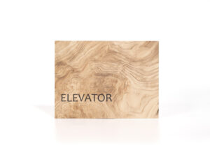 ADA signage with natural look of wood, marble, and hammered metal with Raised Print.