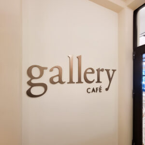 Precision Architectural Plaque and Flat Cut metal signage attached to interior walls. 